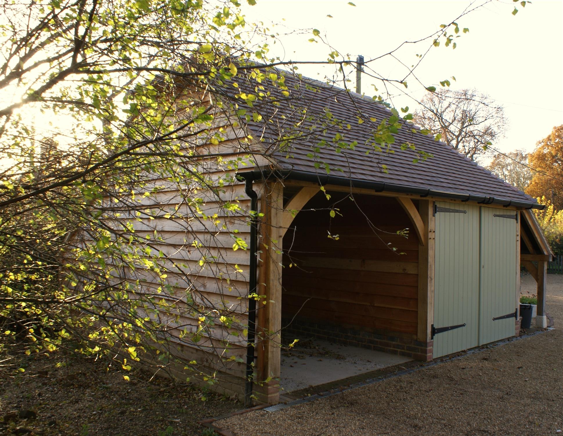 2 bay Garage log store full hip barn hip roof